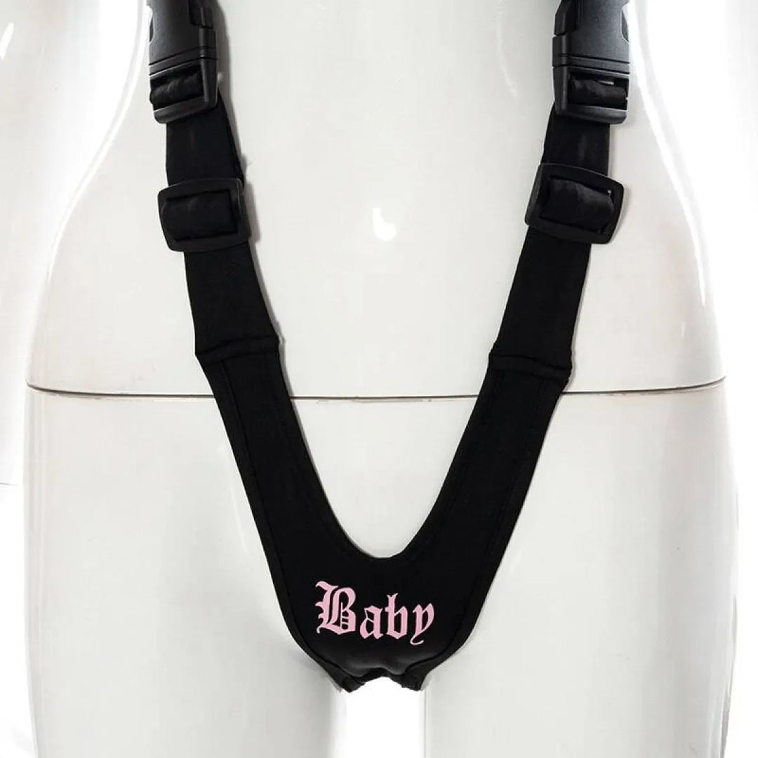 Black Baby cut-out bodysuit with pink Gothic 'Baby' lettering on the front, displayed on a mannequin.